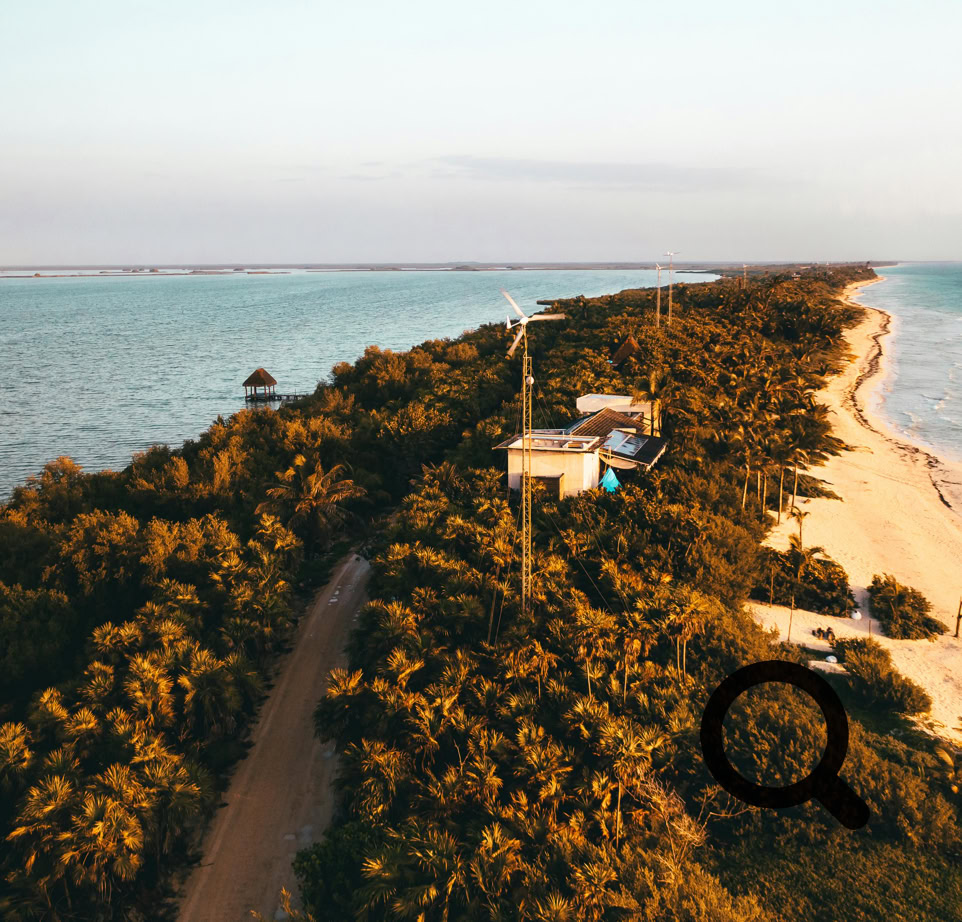 A stunning aerial shot of a lush coastline during sunset, offering a serene blend of nature and tranquility.